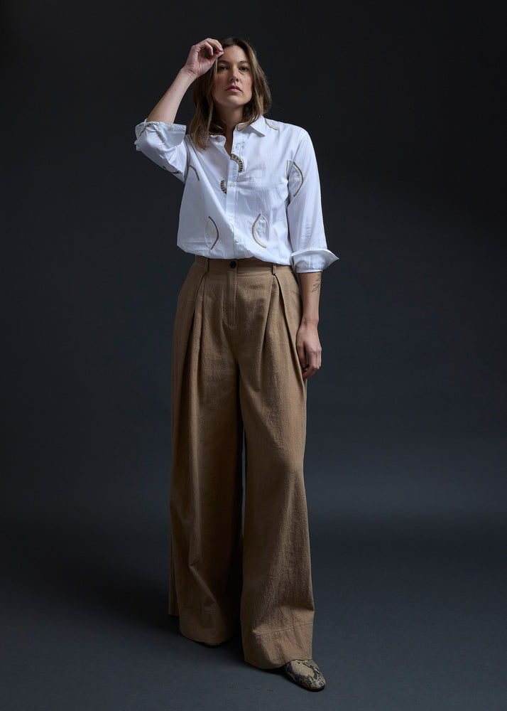 White Eyes Embroidery Gathered Hem Shirt